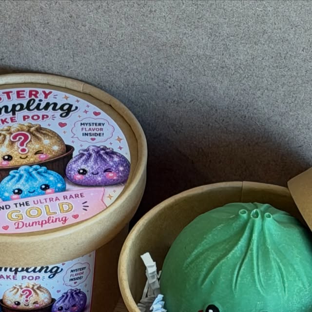 Green cake pop dumpling next to a Mystery Dumpling tub, August 21, 2026.